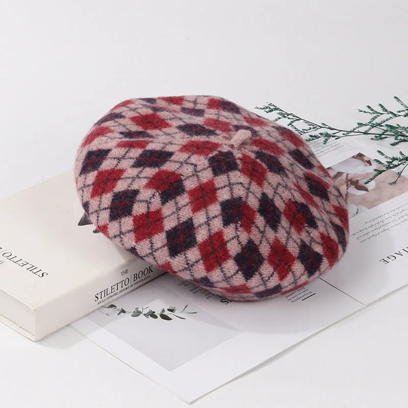 Wool plaid beret with dome crown, adjustable size, and tassel and mesh detail in blue light coffee plaid.