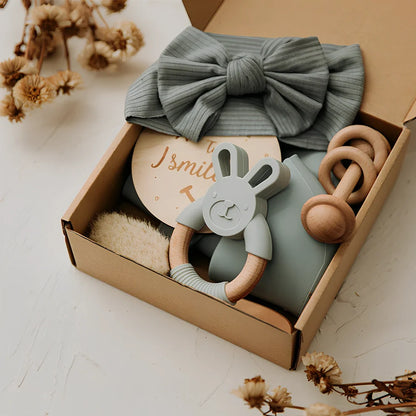 Six wooden animal bath toys floating in water with blue, brown and peach colour options