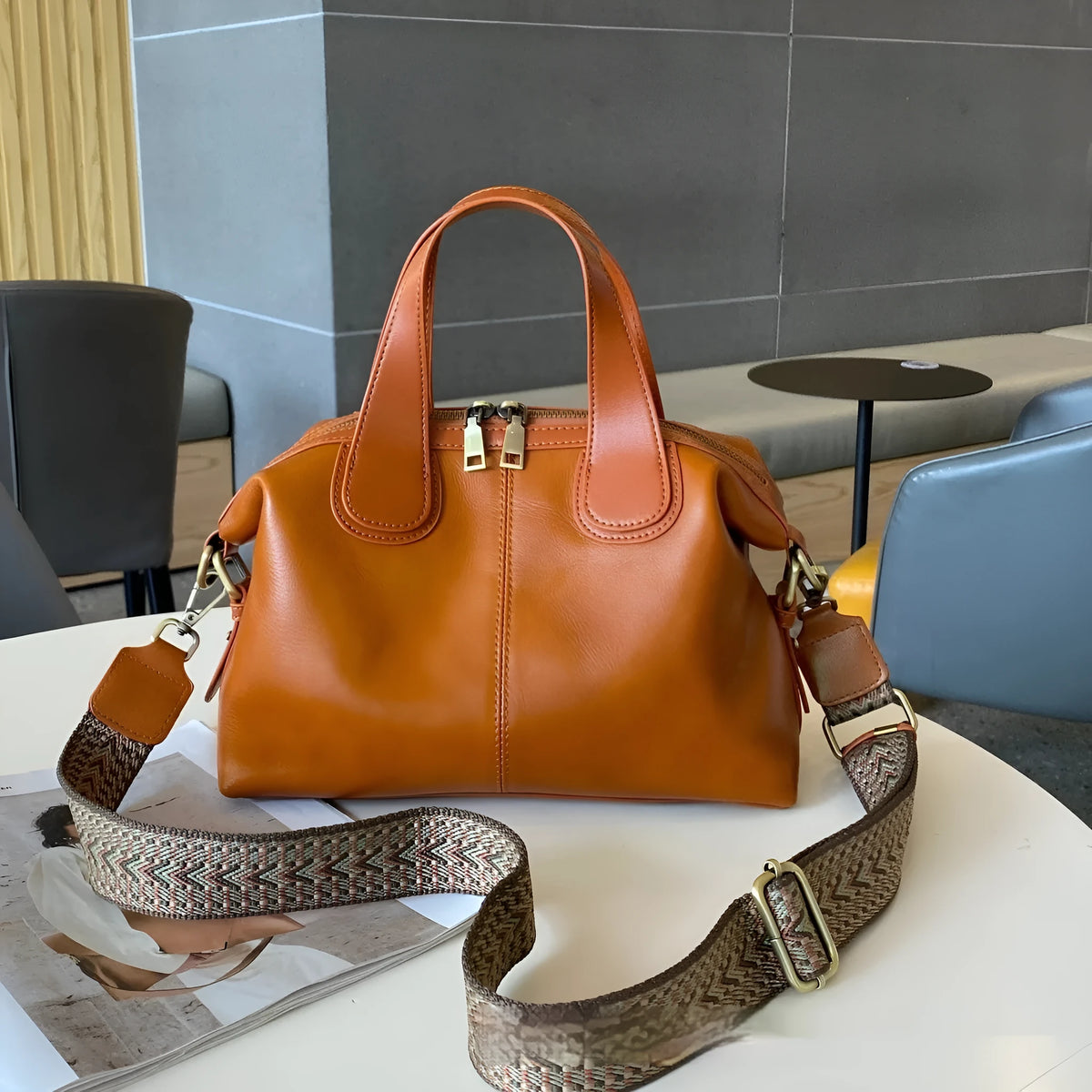 Soft pillow-shaped top grain leather handbag, 30cm x 13cm x 22cm, with double straps and inner patch pocket