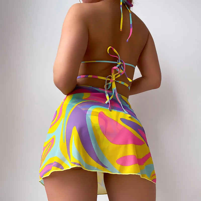 Yellow striped halter neck swimsuit with lace-up front and matching high-waisted skirt and shorts