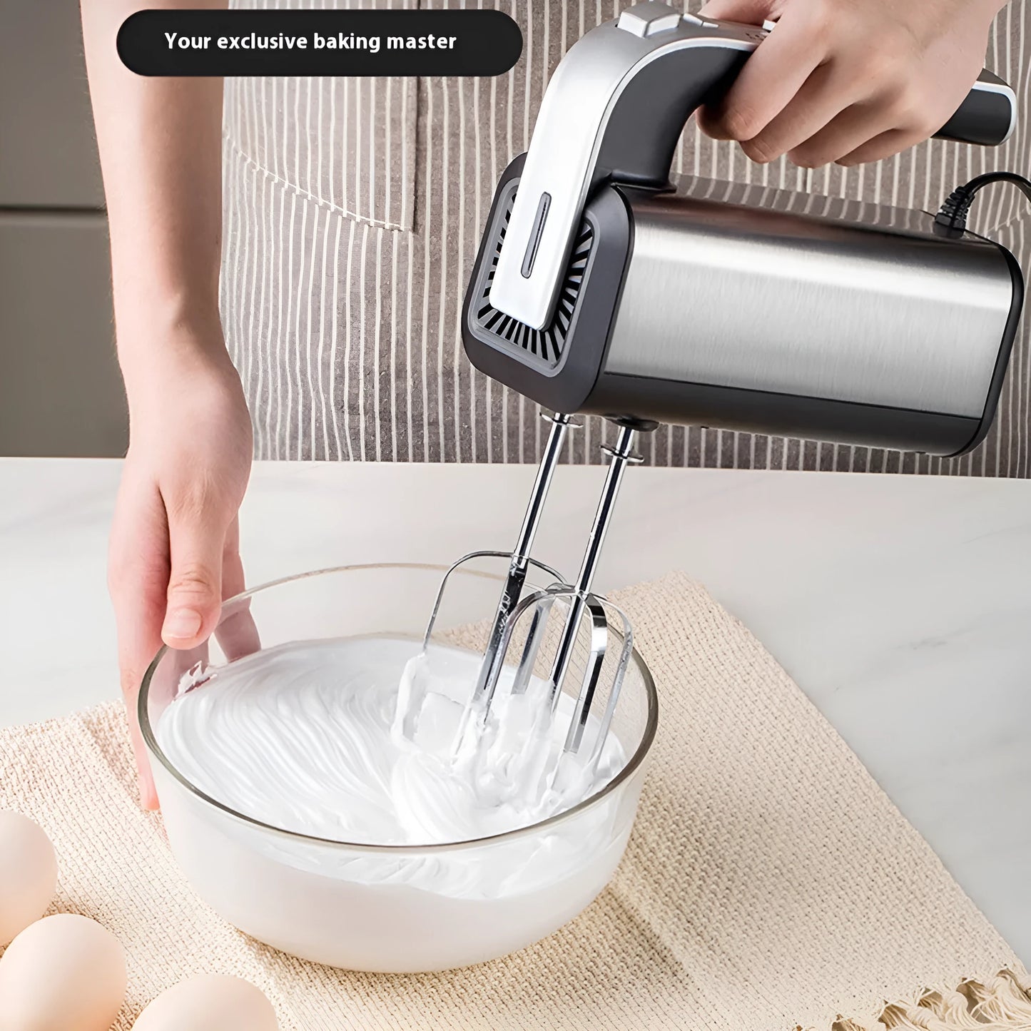Silver handheld electric kitchen whisk with five speed settings and 1000W motor