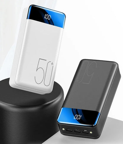 Black or white 50000mAh power bank with three USB output ports, measuring 169x83x52mm