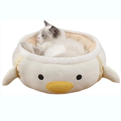 Green chick-shaped cat bed laid flat with hanging straps attached, suitable for small cats