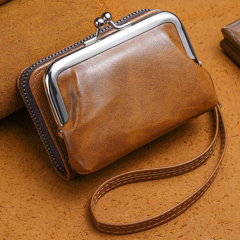 Ladies buckle-fastening coin purse with a 4-inch metal clip and zip, shown in multiple colour options.