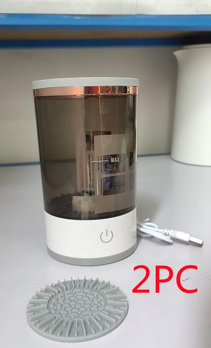 Grey and white portable electric makeup brush cleaner with USB charging cable.