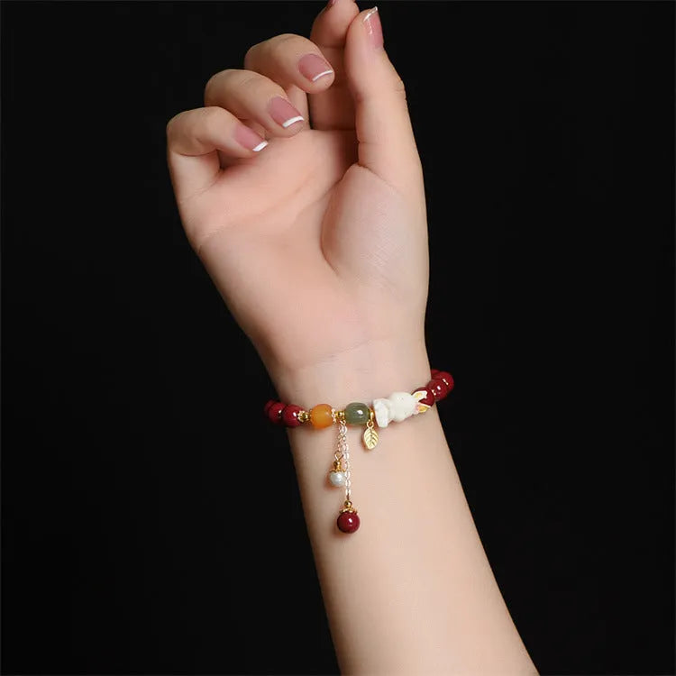 Natural cinnabar rabbit bracelet in beeswax purple and gold sand, national style, shown in 8mm and 10mm sizes.