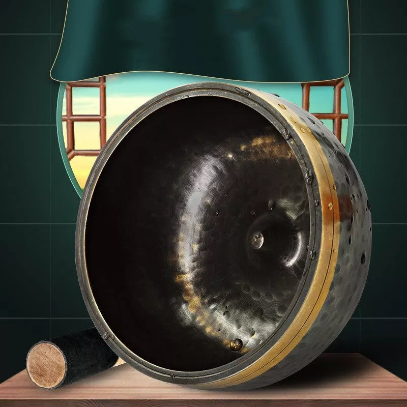 Black and gold copper meditation sound bowl with leather rod and thin pad