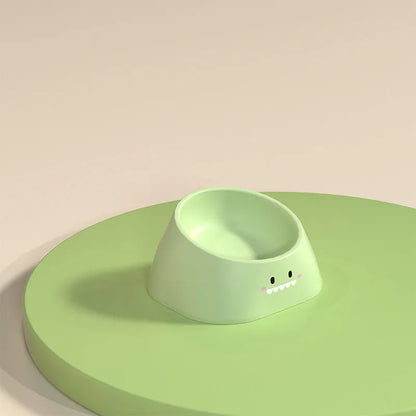 Green tilted stainless steel pet bowl with a 15-degree angle on a white background.
