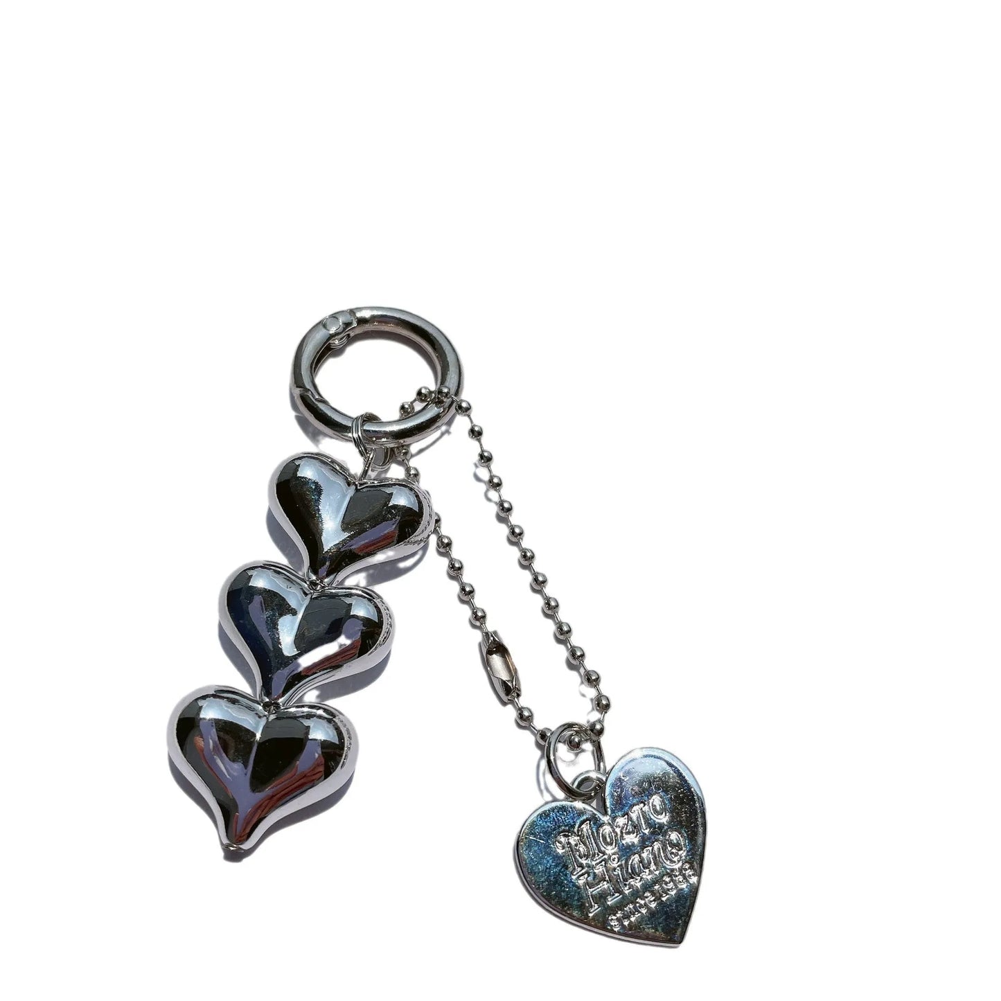 Acrylic key ring with an electroplated decorative charm in a choice of heart, bell, or water drop shapes.