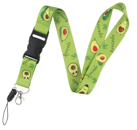 Green avocado cartoon print on a white polyester phone lanyard with a silver buckle.