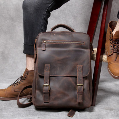 Dark coffee coloured retro leather backpack made from first layer cowhide with organised interior pockets.