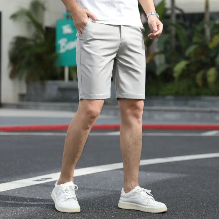 Men's loose elastic waistband fifth pants in solid colour casual styling