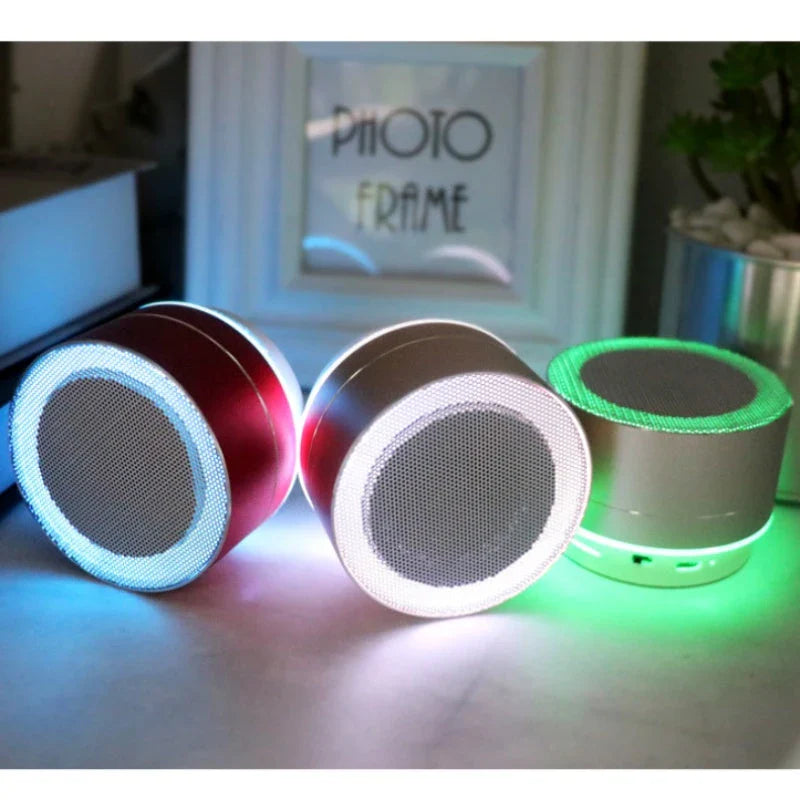 Portable Bluetooth speaker with colorful LED lights, offering impressive sound quality and convenient features for on-the-go music enjoyment.