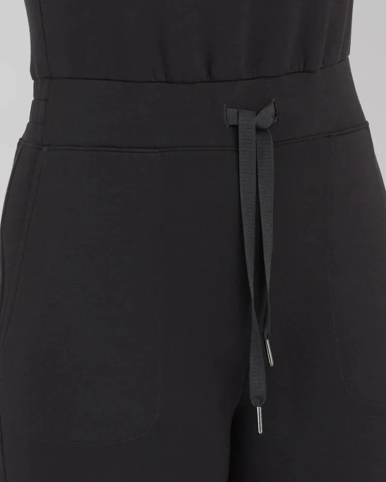 Women's lace-up jumpsuit pants in polyester, available in multiple colors and sizes for adjustable fit.