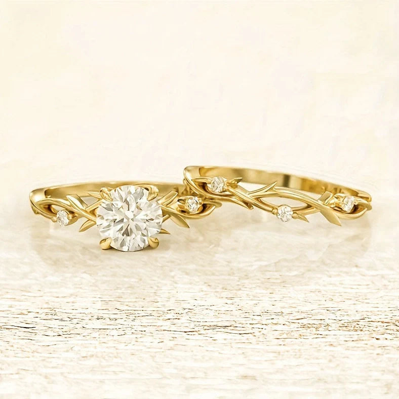 Geometric design rose gold plated couple rings with simulation diamond centrepiece showing faceted edges