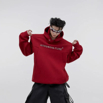 Men's red hooded sweater with heavy shoulder pads and raised metal printing details on front