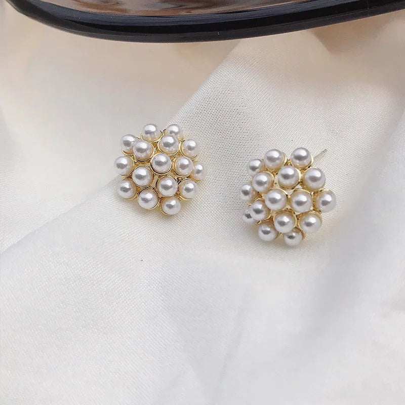 Korean-style women's pineapple starfish pearl alloy earrings with gemstone details in gold, pearl flower, silver, and starfish pearl colours.