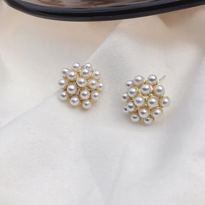 Korean-style women's pineapple starfish pearl alloy earrings with gemstone details in gold, pearl flower, silver, and starfish pearl colours.