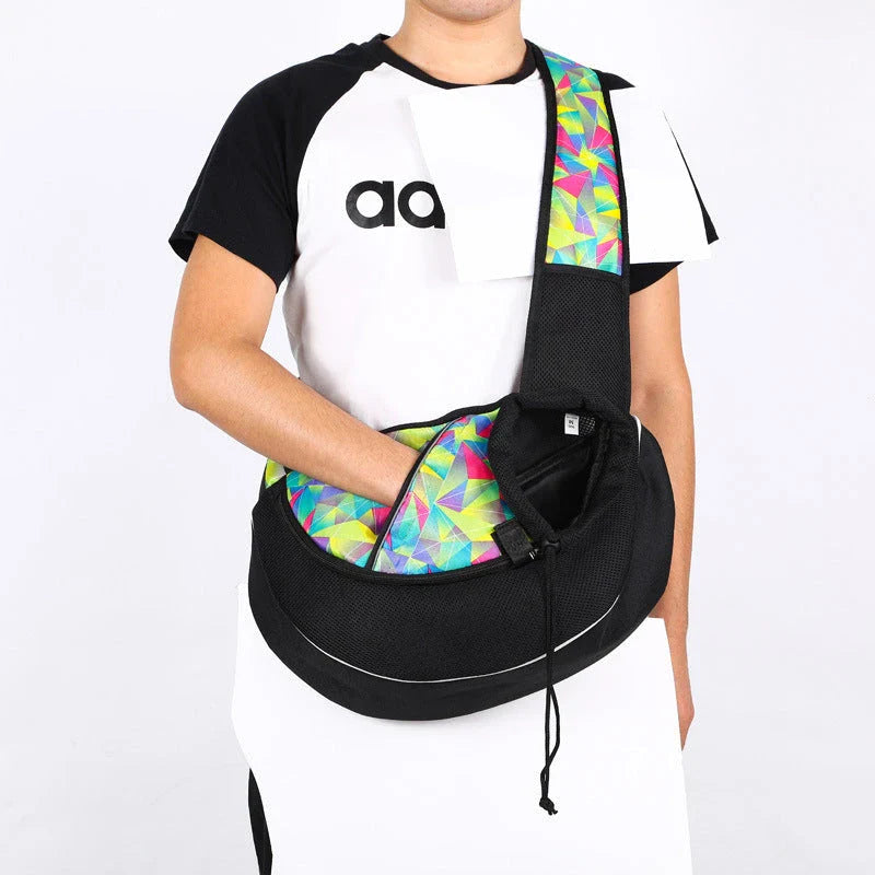 A stylish and secure crossbody bag designed to carry pets comfortably on the go, featuring adjustable drawstring closure and bottom zipper for easy access.