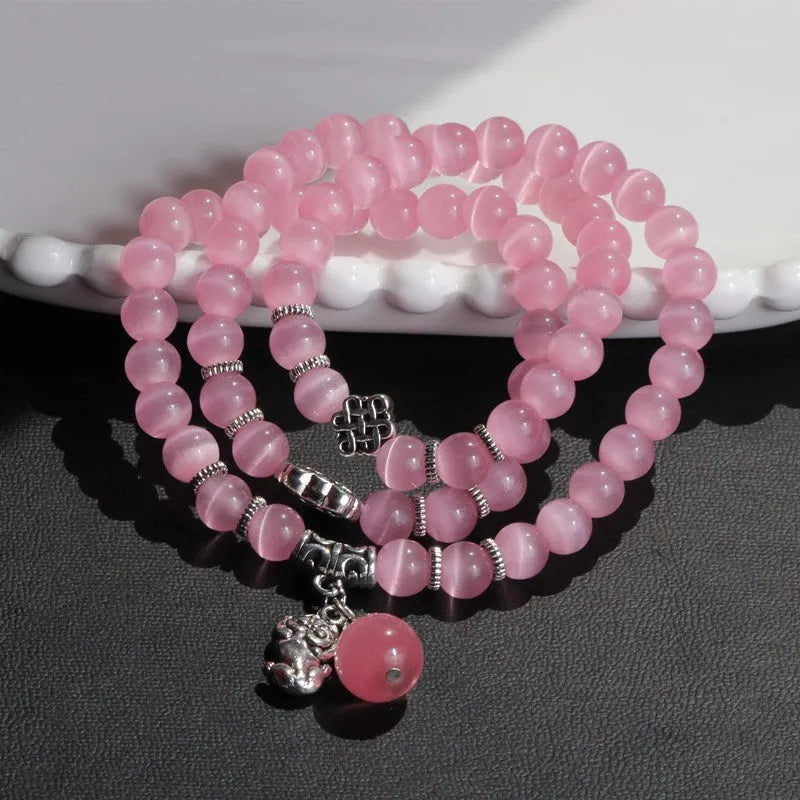 Women's opal crystal bracelet with lucky cat charm and geometric design, shown in blue colour option