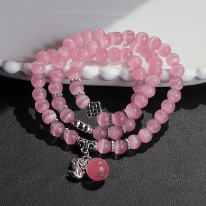 Women's opal crystal bracelet with lucky cat charm and geometric design, shown in blue colour option