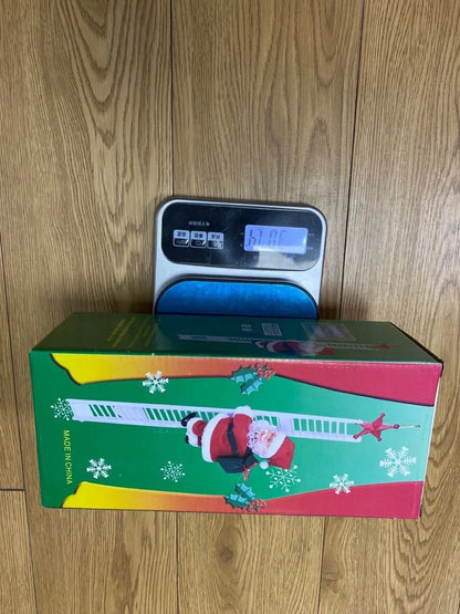 Electric Santa Claus climbing ladder decoration measuring 20cm tall with continuous motion mechanism