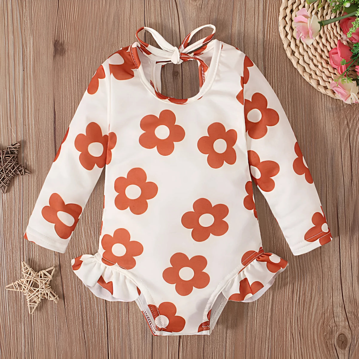 Girl's floral print swimsuit with crew neck and open back design in polyester fabric