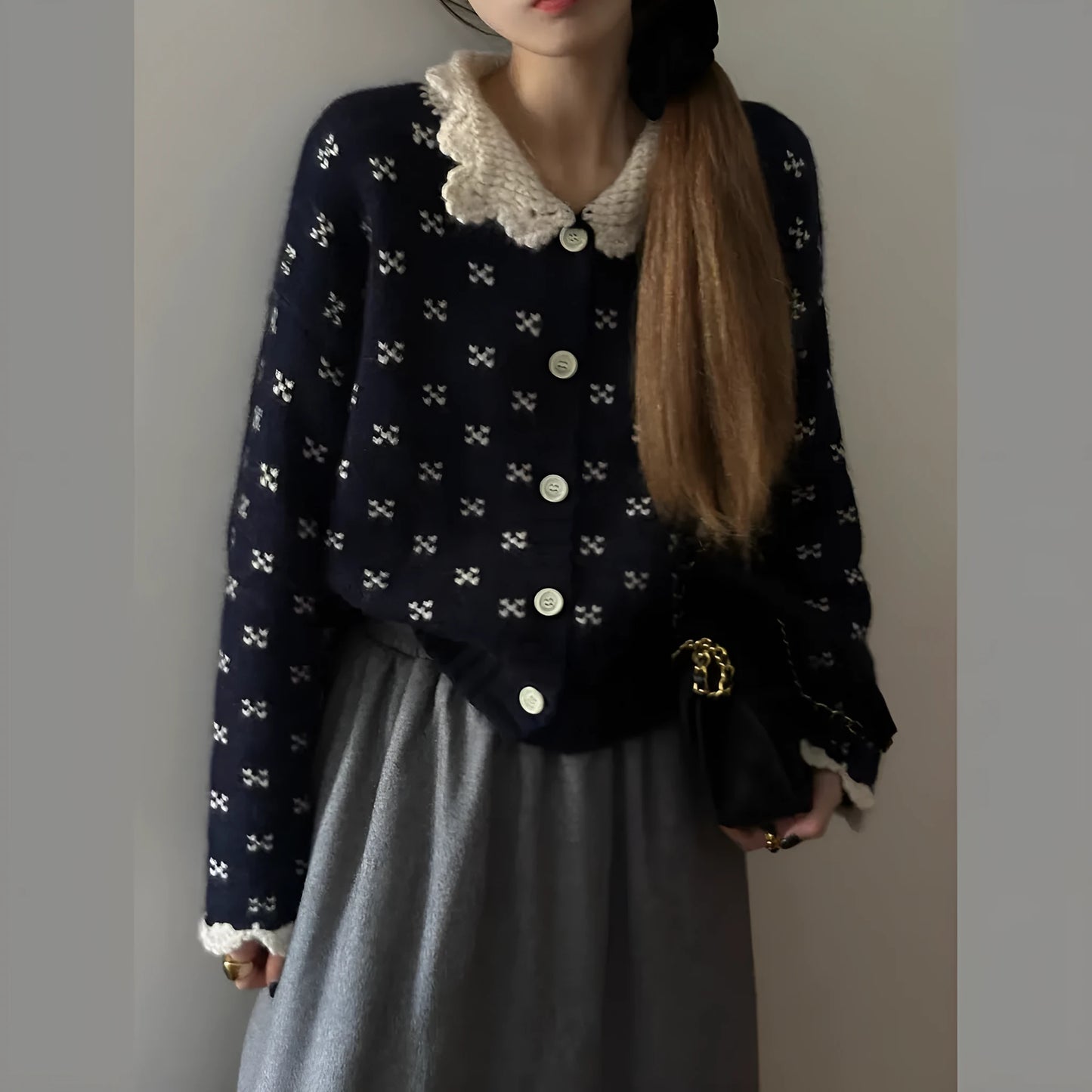 Retro floral patterned cardigan coat with a Peter Pan collar and button front.