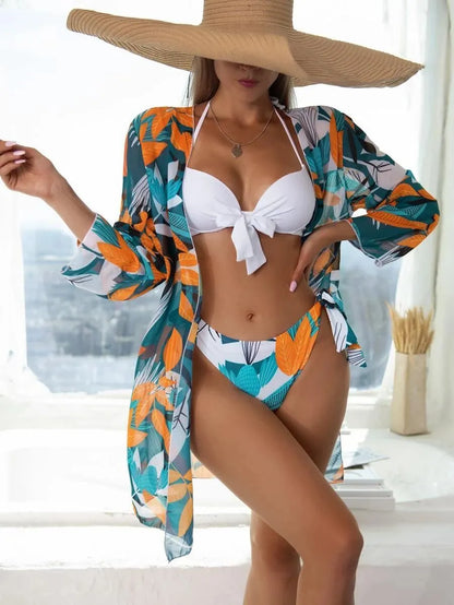 Women's three-piece bikini swimsuit set in polyester with mesh split design.