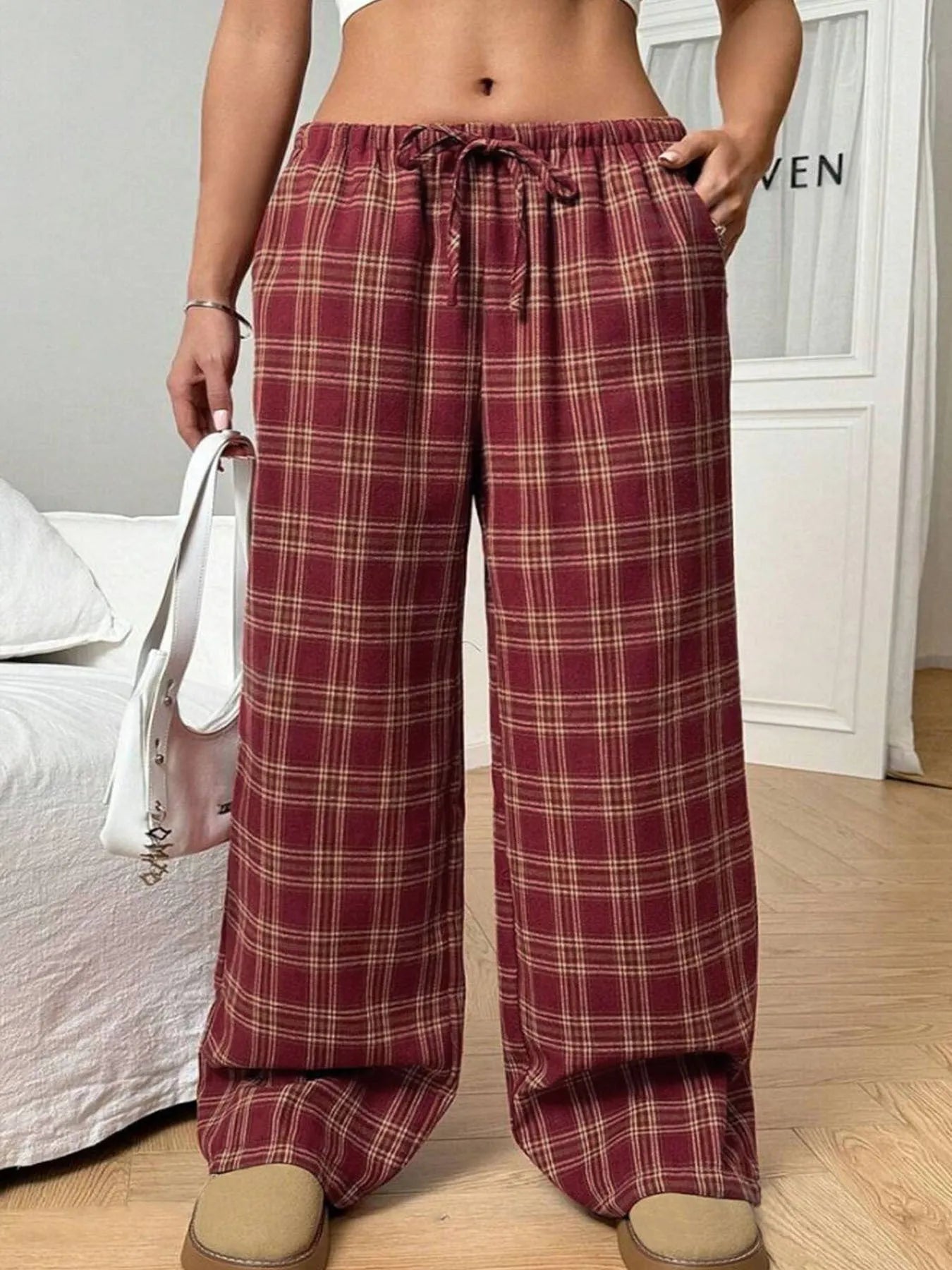 Women's loose plaid trousers with drawstring waist and pockets in red or blue colour options