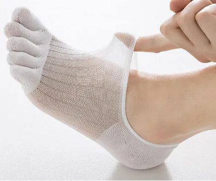 Pair of white five-finger ultra-thin modal boat socks laid flat, showing toe separation and non-slip heel detail.