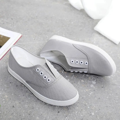 Low-top canvas casual shoes in various colours on a flat sole.