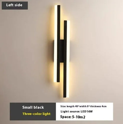 Scandinavian minimalist LED wall light with acrylic shade and adjustable arm in black or gold finish.