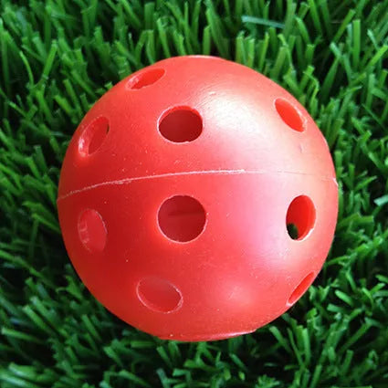 Hollow plastic golf practice balls in various colors for indoor use