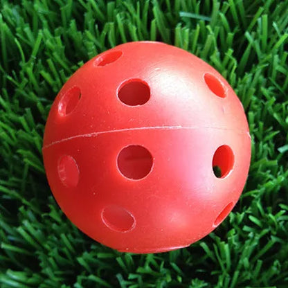 Hollow plastic golf practice balls in various colors for indoor use
