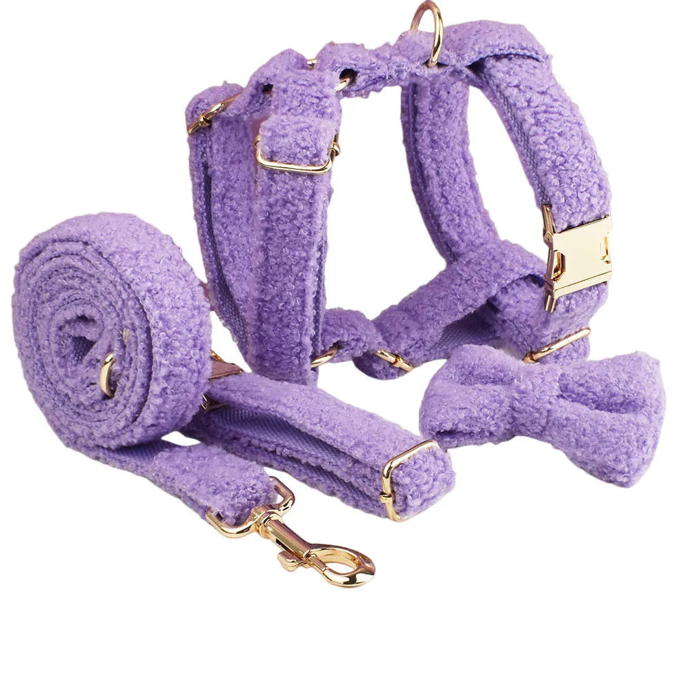 Cloth dog accessory set showing collar, leash, bow, and vest in coordinating fabric