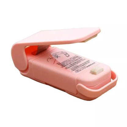 Home Portable Mini Sealing Machine in white and pink with optional magnetic closure