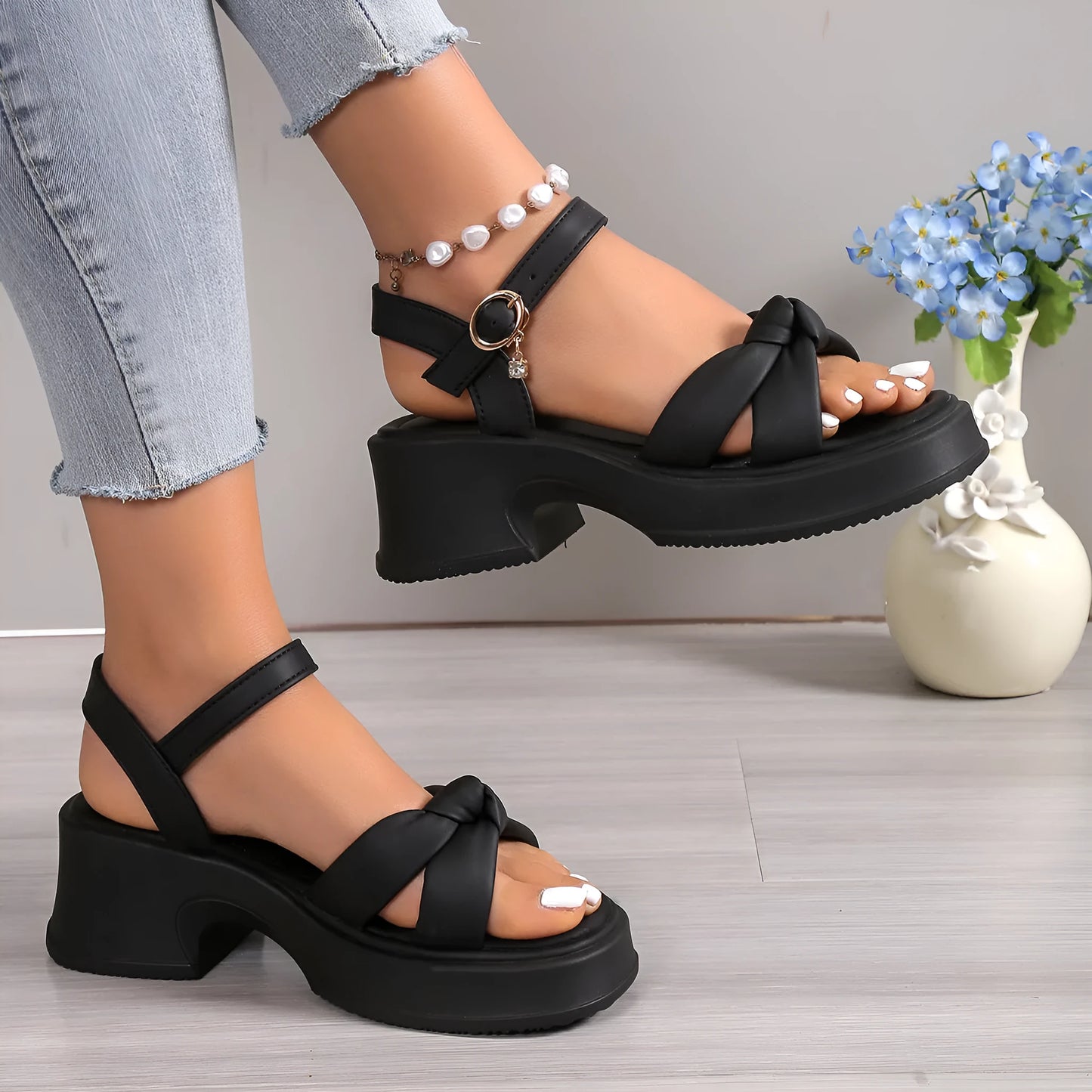 Black thick heel slippers with skirt design detail and button fastening