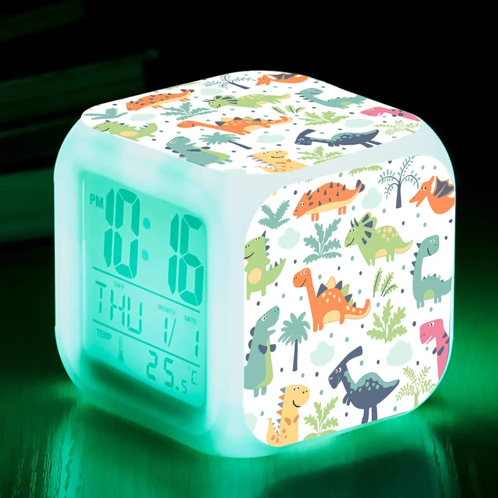 LED Cartoon Alarm Clock with voice control and digital display in pink, blue, green, and dinosaur designs