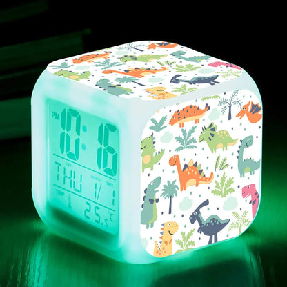 LED Cartoon Alarm Clock with voice control and digital display in pink, blue, green, and dinosaur designs