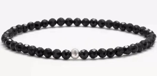 Geometric unisex bracelet with small Obsidian, blue San, and textured black agate beads.
