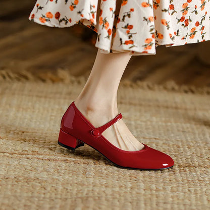 Women's chunky heel retro round head pumps with ankle-strap buckle, two-layer cowhide upper, rubber sole, red or black, sizes 35-39