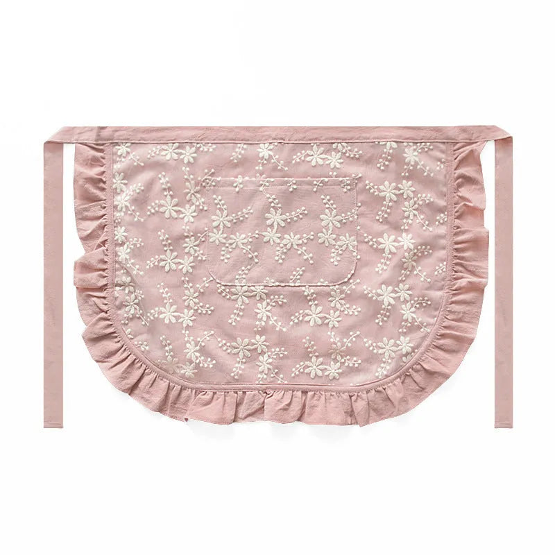 Minimalist kitchen apron with X-strap design in cotton linen fabric showing lace trim detail