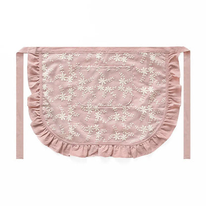 Minimalist kitchen apron with X-strap design in cotton linen fabric showing lace trim detail