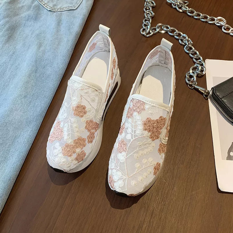 Women's lace mesh high heel sneakers in green and pink with slope heel design