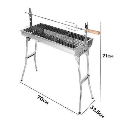 Stainless steel portable barbecue oven with flip mechanism showing checked iron grills and charcoal stove