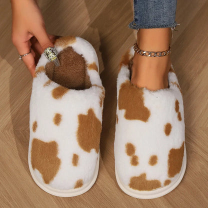 Cozy plush cow-print slippers with non-slip soles for comfortable indoor wear