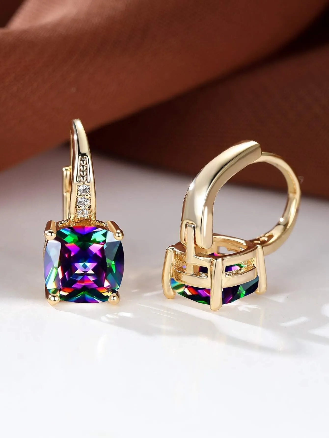 Square geometric ear clips with colourful moissanite inlays and a metallic electroplated finish.