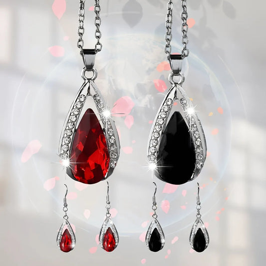 Black red teardrop glass pendant necklace and earrings suite with water droplet design elements on alloy jewellery