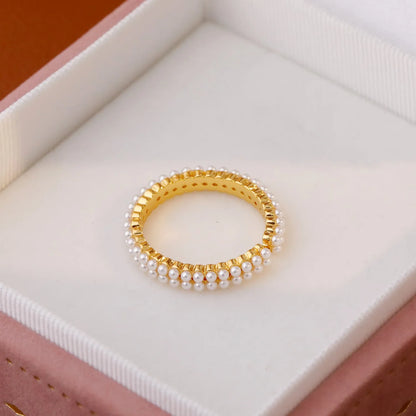 Gold electroplated pearl ring with open mouth geometric design and round pearl elements